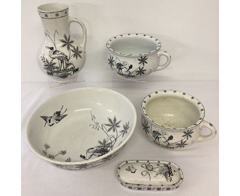 A Victorian William Brownfield "Suez" pattern black and white ceramic bathroom set. Comprising: Water jug and bowl, lidded tr
