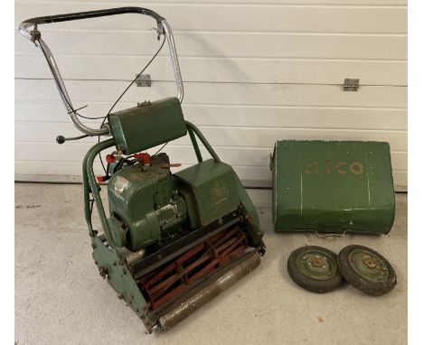 A vintage Atco petrol groundsman's lawn mower with original metal collection grass box. Also has a pair of transport wheels. 