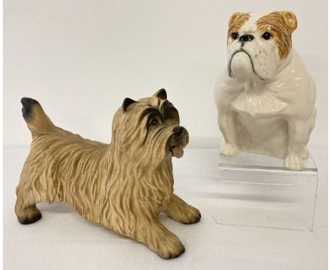 2 Beswick ceramic dog figurines. A matt finish Cairn Terrier model #3082. Together with a Tan and white bulldog model No. D22