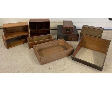 A collection of vintage wooden boxes and crates in varying sizes. Lot includes a slanted display case, glass missing and 2 fi