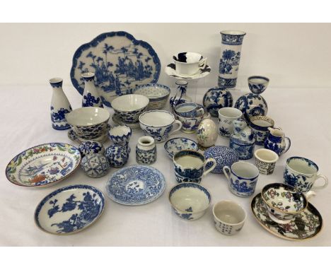 A collection of antique and vintage blue and white ceramics, many in an oriental style. To include cup, dishes, vases, saki j