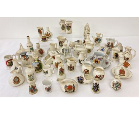 A collection of assorted crested ware ceramic trinkets to include novelty shaped pieces. Lot includes pieces by Goss, Arcadia