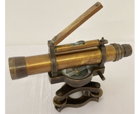 A small brass cased swivel telescope with integral compass and spirit level. Marked to top "Ross London". Approx. 13cm tall x