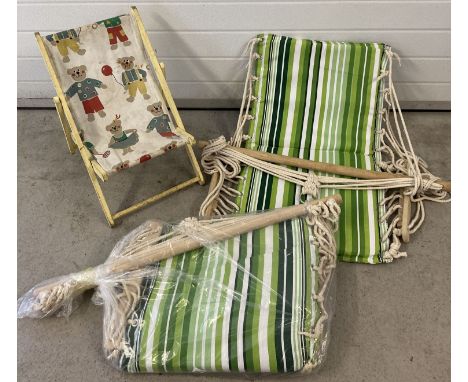 2 modern garden green stripe hanging hammock chairs together with a vintage child's deck chair.  