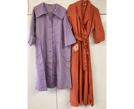 2 items of 1950's vintage clothing. An orange raw silk dressing gown by Toguette with cream embroidery detail to front pocket