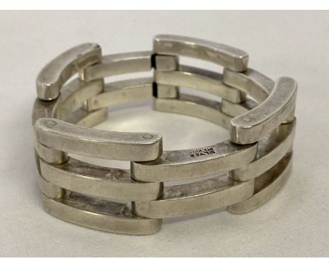 A Mexico Silver gate design bracelet with double hook fastening. Wear to one link. Marked "Mexico Silver". Approx. 7.5 inches