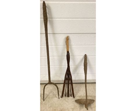 3 old tools. An antique eel spear on replacement short wooden handle. Together with a vintage 2 pronged pitchfork and a hoe, 