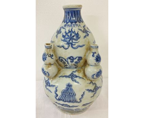 A blue and white Chinese ceramic bottle gourd shaped vase with hand painted detail.  Approx. 28cm tall.