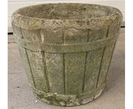 A vintage concrete half barrel design garden planter with drainage hole to base.  Approx 33cm tall x 40cm diameter.