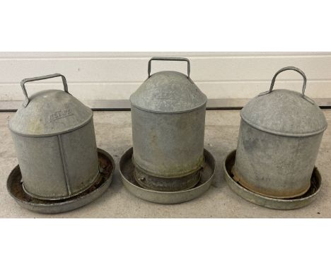 3 vintage galvanised metal bird feeders, to include Eltex.  Largest approx. 34cm tall.