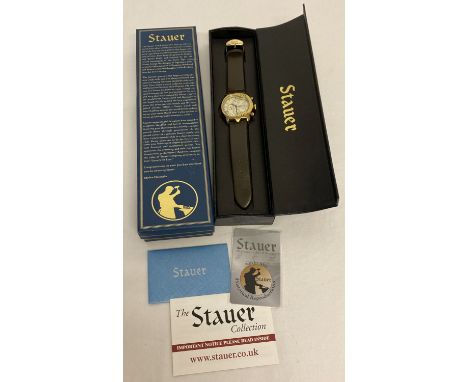 A boxed Stauer Guitar automatic wristwatch complete with instruction booklet and leaflets. Chronograph style watch with gold 