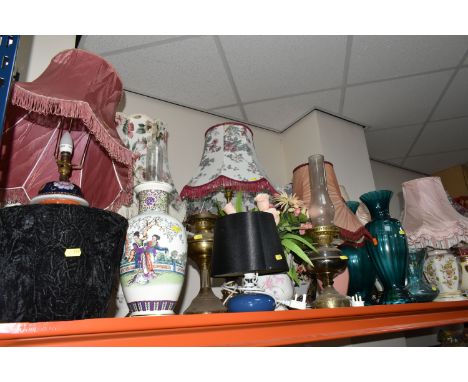 A LARGE GROUP OF ORNAMENTAL LAMPS AND VASES comprising approximately thirteen lamps in assorted styles to include ceramic, gl