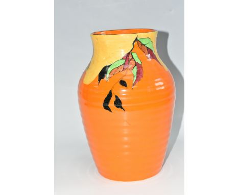 A CLARICE CLIFF 'INDIAN SUMMER' PATTERN ISIS VASE, the baluster vase painted with flowers and leaves on an orange ground, bla