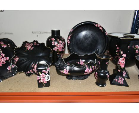 A GROUP OF ELEVEN EARLY CARLTON WARE PATTERN 528 ORNAMENTS to include a quantity of black ornaments with cherry blossom patte