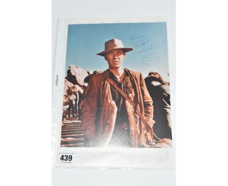 A SIGNED 10 x 8 COLOUR PROMO PHOTOGRAPH OF DAVID CARRADINE in Kung Fu, signed in blue ink, portrait orientation, accompanied 