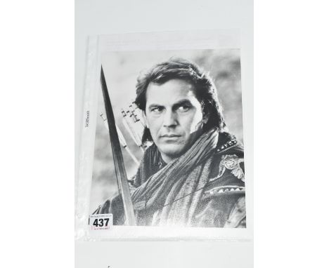 A SIGNED 10 x 8 BLACK &amp; WHITE PROMO PHOTOGRAPH OF KEVIN COSTNER in Robin Hood, signed in black ink, portrait orientation,