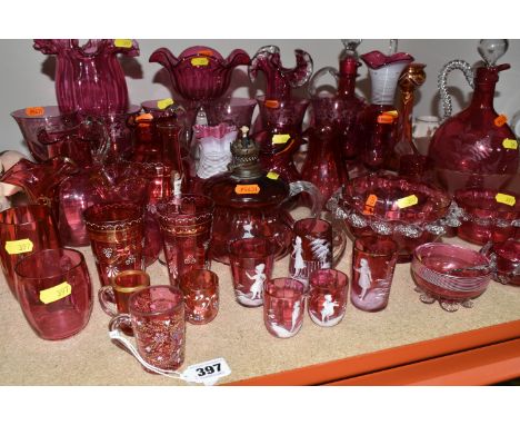 A COLLECTION OF CRANBERRY GLASS to include six etched wine glasses, a quantity of Mary Gregory style glasses, a pair of candl