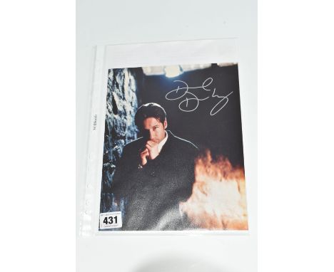 A SIGNED 10 X 8 PROMOTION PORTRAIT OF DAVID DUCHOVNY IN X-FILES, portrait orientation, signed in silver marker, accompanied b