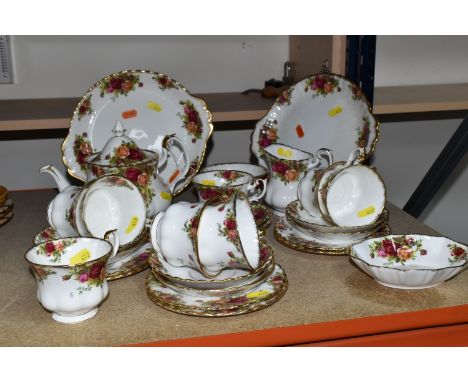 A TWENTY-EIGHT PIECE ROYAL ALBERT OLD COUNTRY ROSES TEA SERVICE to include a teapot (chip to the lid), eight tea cups (two wi