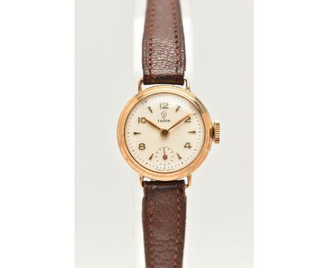 A LADY'S TUDOR WATCH WITH 9CT GOLD HEAD, the white circular face with gold coloured Arabic numerals and baton markers, subsid