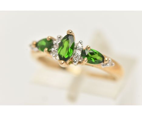 A 9CT GOLD GEM RING, designed as a central marquise shape green gem flanked by single cut diamonds and pear shape green gems,