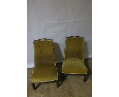 A PAIR OF MAHOGANY CARVED SIDECHAIRS, the rectangular close upholstered buttoned back with gold velvet and braiding raised on