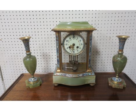 A CONTINENTAL THREE PIECE GREEN MARBLE CLOCK GARNITURE, comprising  a clock with white enamelled dial housed in a glass brass