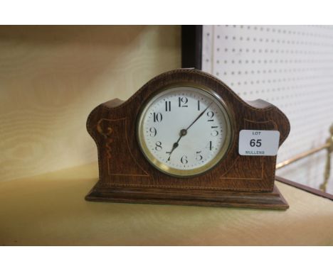 AN EARLY 20th CENTURY ROSEWOOD AND MARQUETRY INLAID MANTLE CLOCK the white enamel dial within a brass bezel with domed top an