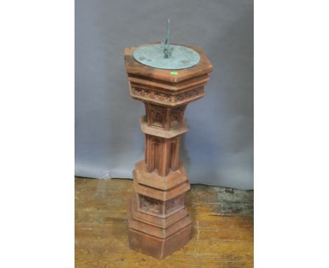 A VICTORIAN STYLE SUNDIAL, the gothic style hexagonal tapering plinth fitted with a metal dial engraved with the Sun and scri