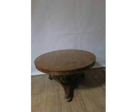 A VICTORIAN ROSEWOOD CENTRE TABLE, the circular top with a recessed frieze raised on a tapering pod with tripod platformbase 