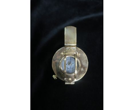 A BRASS FRAMED COMPASS, of circular form.