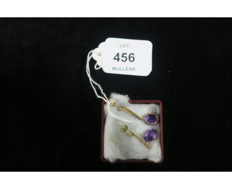 A PAIR OF GOLD AND AMETHYST EARRINGS