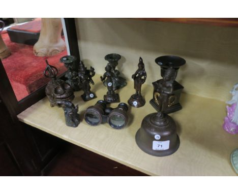 A MISCELLANEOUS COLLECTION OF BRASS including oriental style figures, a pair of candle stick holders, binoculars, a bell etc.