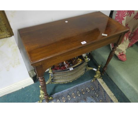 AN EDWARDIAN MAHOGANY FOLDOVER CARD TABLE the rectangular top on a plain frieze on turned legs 74cm X 92cm X 44cm