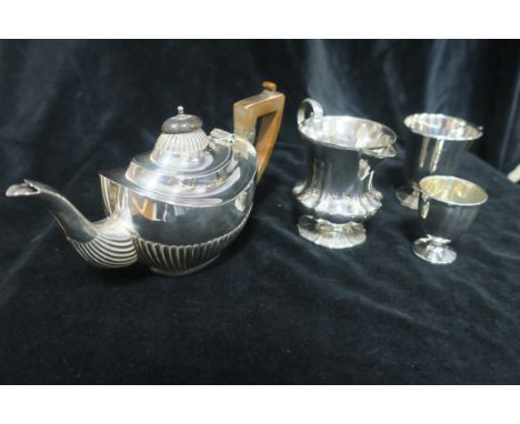 A COLLECTION OF SILVER, to include a cream jug, bachelors teapot, egg cup, etc. (4).