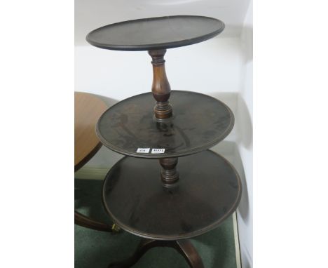 A GEORGIAN MAHOGANY THREE TIER GRADUATED DUMB WAITER each circular dish joined by a baluster support on tripod base 120cm x 6