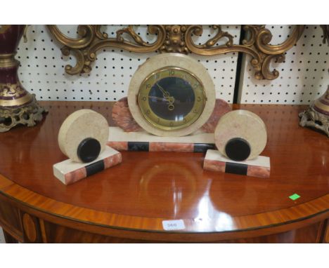 AN ART DECO STYLE CLOCK GARNITURE, the circular case with brass dial raised on rectangular three coloured marble base with ma