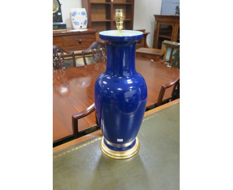 A BLUE GLAZED TABLE LAMP, of tapering bulbous form on gilt circular base,56cms high