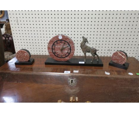 AN ART DECO STYLE TWO COLOURED MARBLE CLOCK GARNITURE, within a circular case raised on a rectangular base.