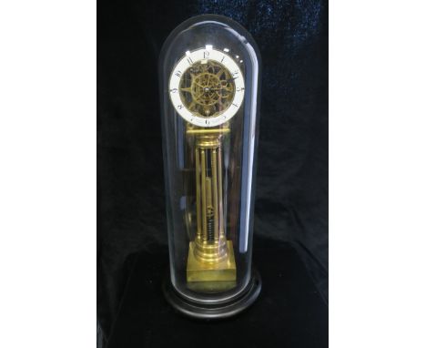 A BRASS FRAMED SKELETON CLOCK, with enamelled dial enscribed "Wm Smith - Musselburgh, Inventor", on cluster column support, w