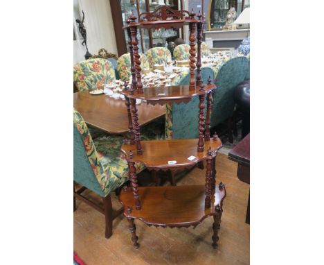 A GOOD VICTORIAN ROSEWOOD FOUR TIER WHAT NOT, each moulded shelf joined by a barley twist upright on baluster legs,132cms hig