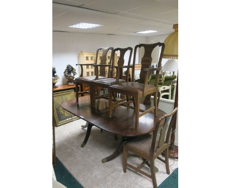 A SEVEN PIECE MAHOGANY DINING ROOM SUITE, comprising a regency style dining room table with one loose leaf on tripod support,
