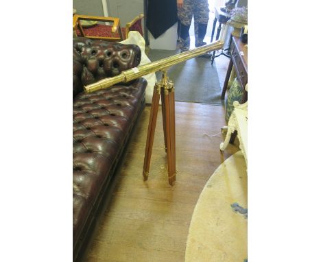A BRASS TELESCOPE, on adjustable tripod support.