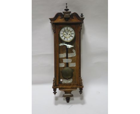 A KINGWOOD AND WALNUT CASED CLOCK, the white enamel and brass dial with roman numerials with glazed panel between reeded pill