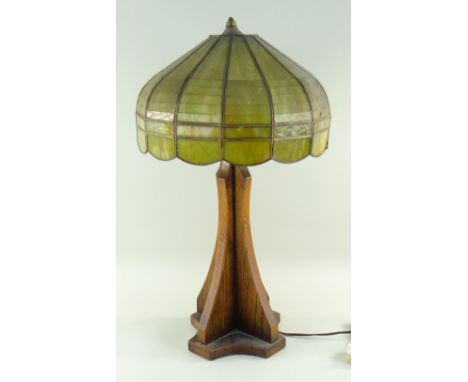 ARTS &amp; CRAFTS MISSION-STYLE OAK TABLE LAMP, domed segmented green glass shade on a cruciform section and slender waisted 