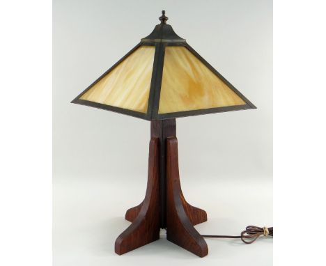 ARTS &amp; CRAFTS MISSION-STYLE OAK TABLE LAMP, with pyramidal opaque glass shade, on a cruciform section column and square b