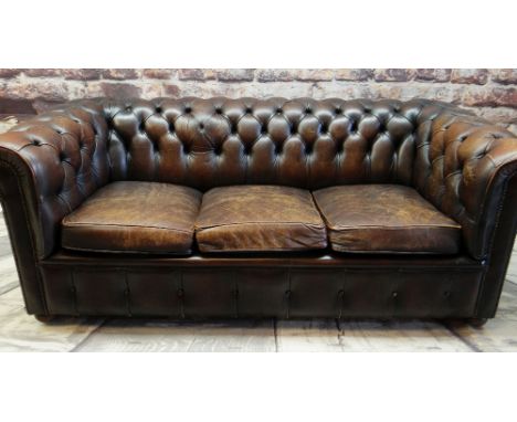 REPRODUCTION VICTORIAN-STYLE BROWN LEATHER CHESTERFIELD SOFA, three loose seat cushions, close nailed and button upholstered,