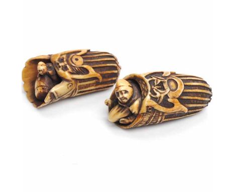TWO EARLY 20TH CENTURY JAPANESE IVORY NETSUKE
each modelled with a figure emerging from a rolled leaf like form, 6cm long 