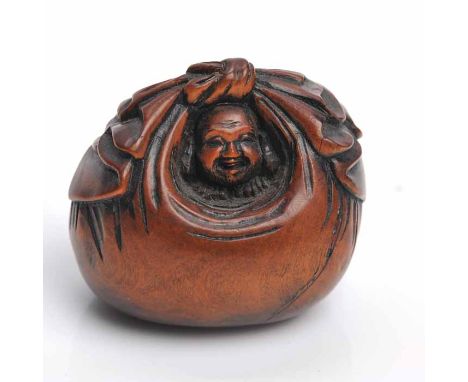 EARLY 20TH CENTURY JAPANESE NUT NETSUKE
modelled as a figure inside a basket, 3.5cm high 