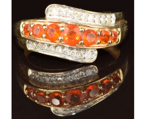 A 9k gold ring set with fire opals and diamonds, 2.8g, size N